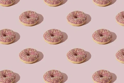 Simple doughnut layout. Pastel pink color background. Stock Photos