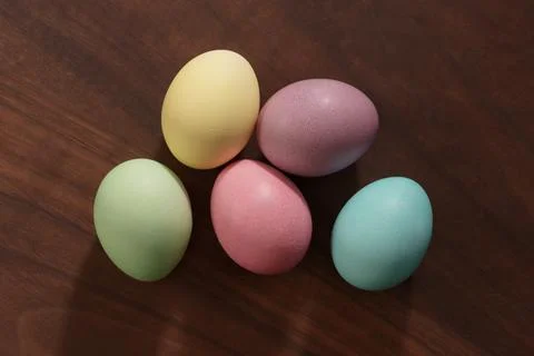 Simple easter eggs on walnut wood table top view Stock Photos