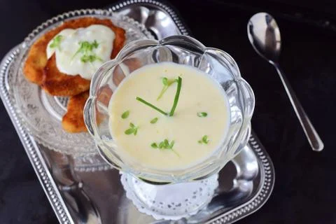 Simple easy to cook milk based gravy in a glass on a metal tray. Healthy food Stock Photos