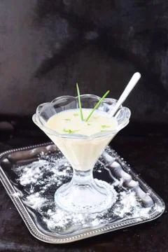 Simple easy to cook milk based gravy in a glass on a metal tray. Healthy food Stock Photos