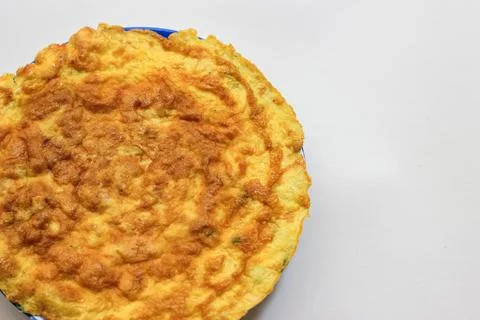 Simple egg omelette with herbs on white background Stock Photos