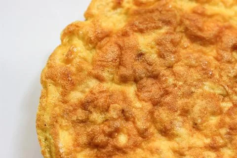 Simple egg omelette with herbs on white background Stock Photos