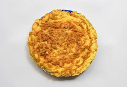 Simple egg omelette with herbs on white background Stock Photos
