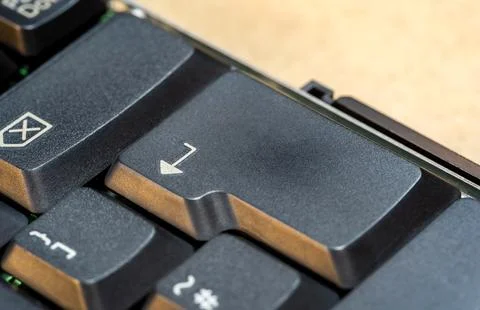 A simple enter key on a laptop computer keyboard, object macro detail, extr.. Stock Photos