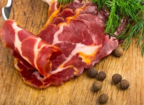 Simple farm bacon, stranded on a fork Stock Photos