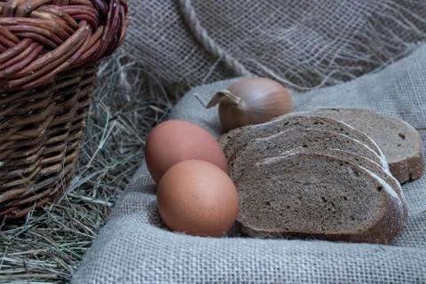 Simple food, bread, boiled eggs, onions. Stock Photos