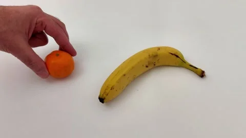Simple Fruit Composition: Ripened Banana and Mandarin Orange Video stock 323259842