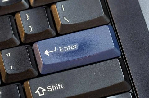 Simple generic wide ANSI layout blue enter key on a modern laptop computer .. Stock Photos