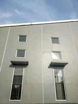 Simple gray facade of the building Stock Photos