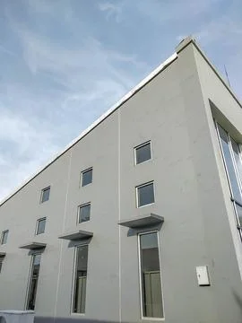 Simple gray facade of the building Stock-Fotos