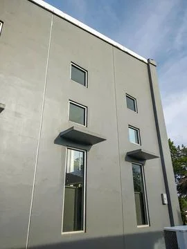 Simple gray facade of the building Stock Photos