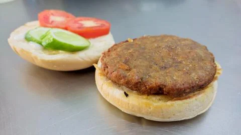 Simple hamburger placed on the table for product display. Stock Photos