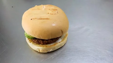 Simple hamburger placed on the table for product display. Stock Photos