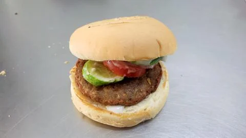 Simple hamburger placed on the table for product display. Stock Photos