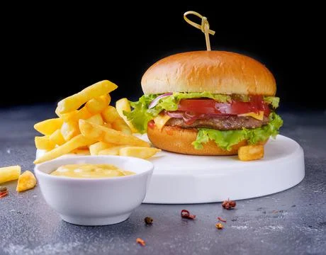 A simple hamburger on a white plate. Stock-Fotos