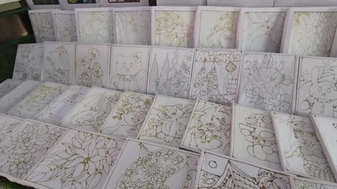 Simple Hand-Drawn Wax Canting Patterns on Framed Fabric for Beginner Batik Art Stock Footage 333480794