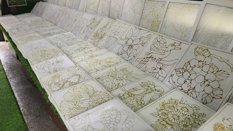 Simple Hand-Drawn Wax Canting Patterns on Framed Fabric for Beginner Batik Art Stock Footage 333480821