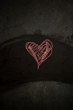 Simple Heart Shape Drawn on a Dark Surface for Valentines Day Digital Content Stock Photos