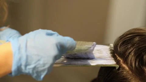 Simple at-home hair highlighting tutorial, guiding you to create blonde Stock Footage 292292082