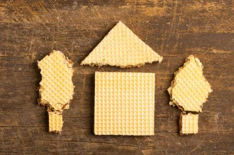 Simple house design illustrated by using rectangular and a triangular cookie on Stock Photos