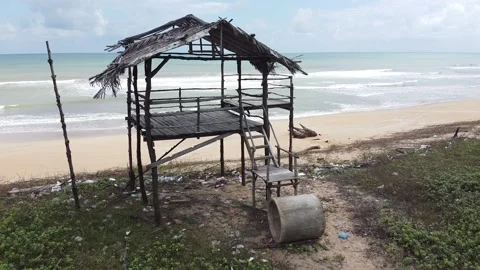 Simple hut on sandy beach, drone footage Stock Footage 146272930