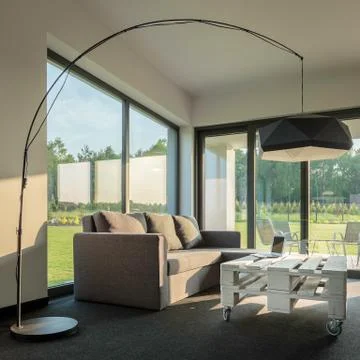 Simple interior with modern lamp Stock Photos