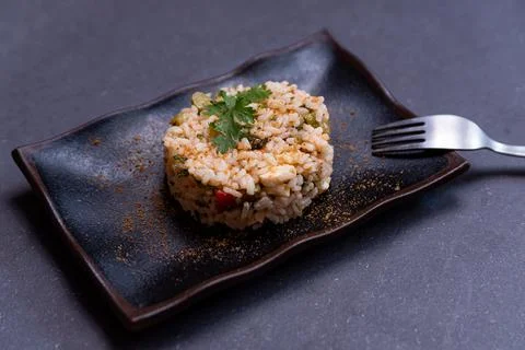 Simple italian spring risotto on dark background with bottarga on dark backgr Fotos Stock