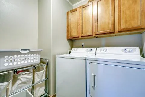 Simple laundry room interior Stock Photos
