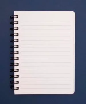 Simple Lined Notebook Opened on a Blue Background Stock Photos
