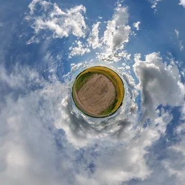 Simple little tiny planet without buildings in blue sky with sun and beautifu Stock Photos