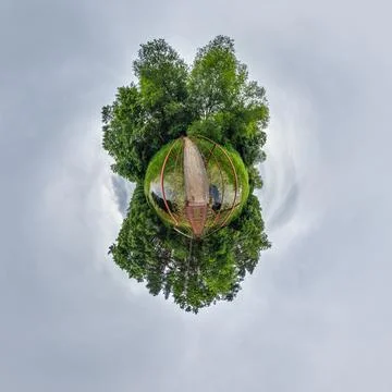 Simple little tiny planet without buildings in blue sky with sun and beautifu Stock Photos