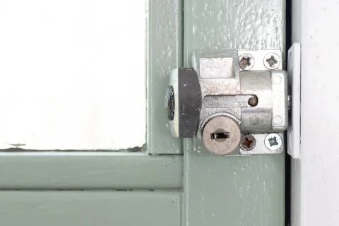 Simple lock on the inside of a window Stock Photos