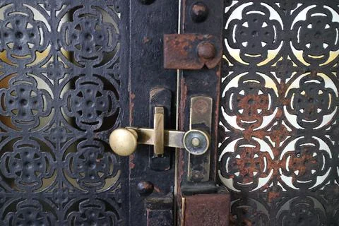 Simple lock on scrap metal window Stock Photos