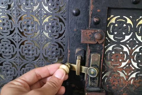 Simple lock on scrap metal window Stock Photos