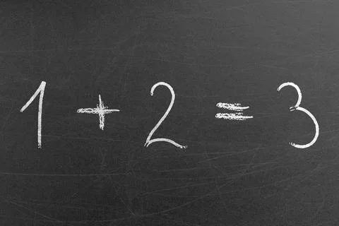 Simple math equation 1 plus 2 is 3 written on a chalkboard for pre-school kids Stock Photos
