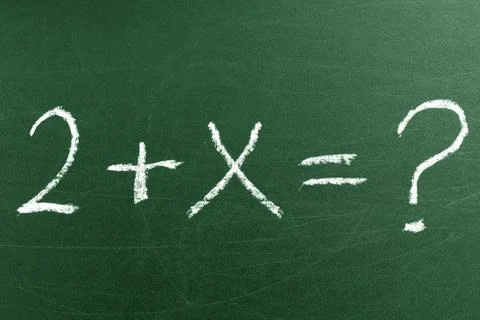 Simple math equation on the green chalkboard in elementary School Stock Photos