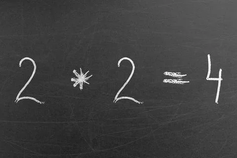 Simple math multiplication equation on the chalkboard with 2 and 4 numbers Stock Photos