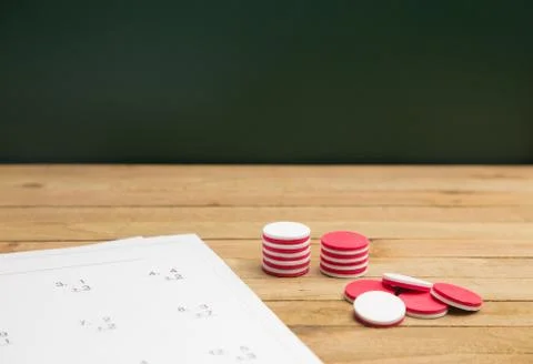 Simple Math Worksheet on a Wooden Table Stock Photos