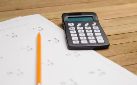 Simple Math Worksheet on a Wooden Table Foto stock