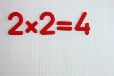 A simple mathematical example in a clean school notebook. Back to school. Foto stock