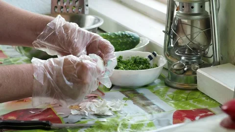 Simple meal. The cook is peeling an egg over the table. Video stock 135163296