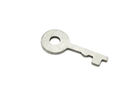 Simple metallic key on white background Stock Photos