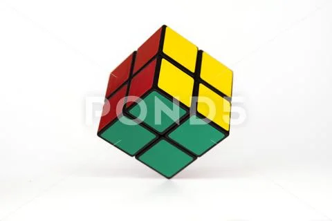 Simple mind challanging puzzle, cube hovering, white background, simplicity. Stock Photos