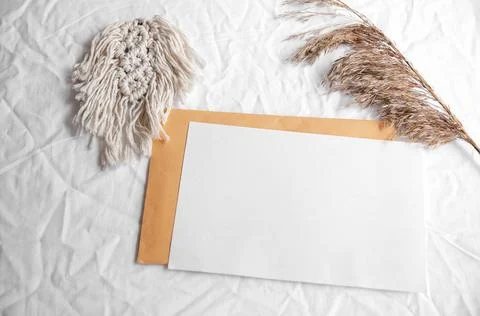 Simple minimal flat lay on white textile with dry earth color neutral beige w Stock Photos