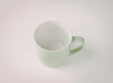 Simple mint green ceramic coffee mug with handle Photos