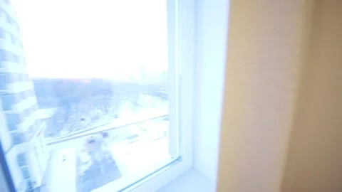 Simple modern bedroom with double bed, tv and window in apartment Stock Footage 276364297
