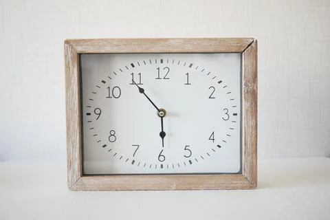 Simple modern clock on table Stock Photos