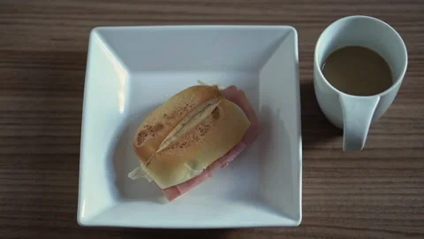 Simple morning coffee. Bread. Ham. Coffee. Wooden table. Stock Footage 137676680