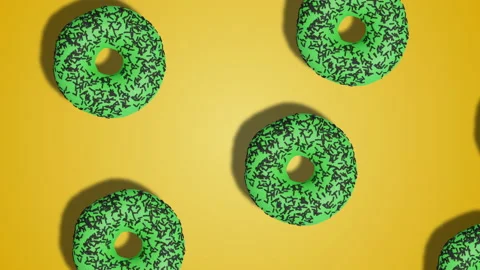 Simple motion design, pattern of green glazen donuts on yellow background Stock Footage 196479276
