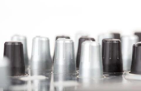 Simple multiple audio mixer knobs object side view, background, copy space Stock Photos